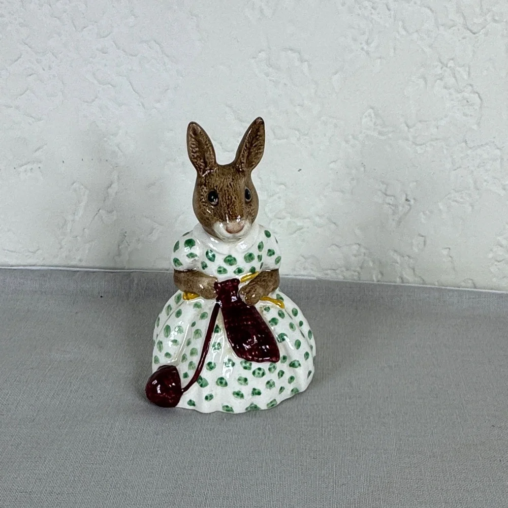 Brown Bunny Figurine in White Dress with Green Polka Dots and Maroon Accessory‎